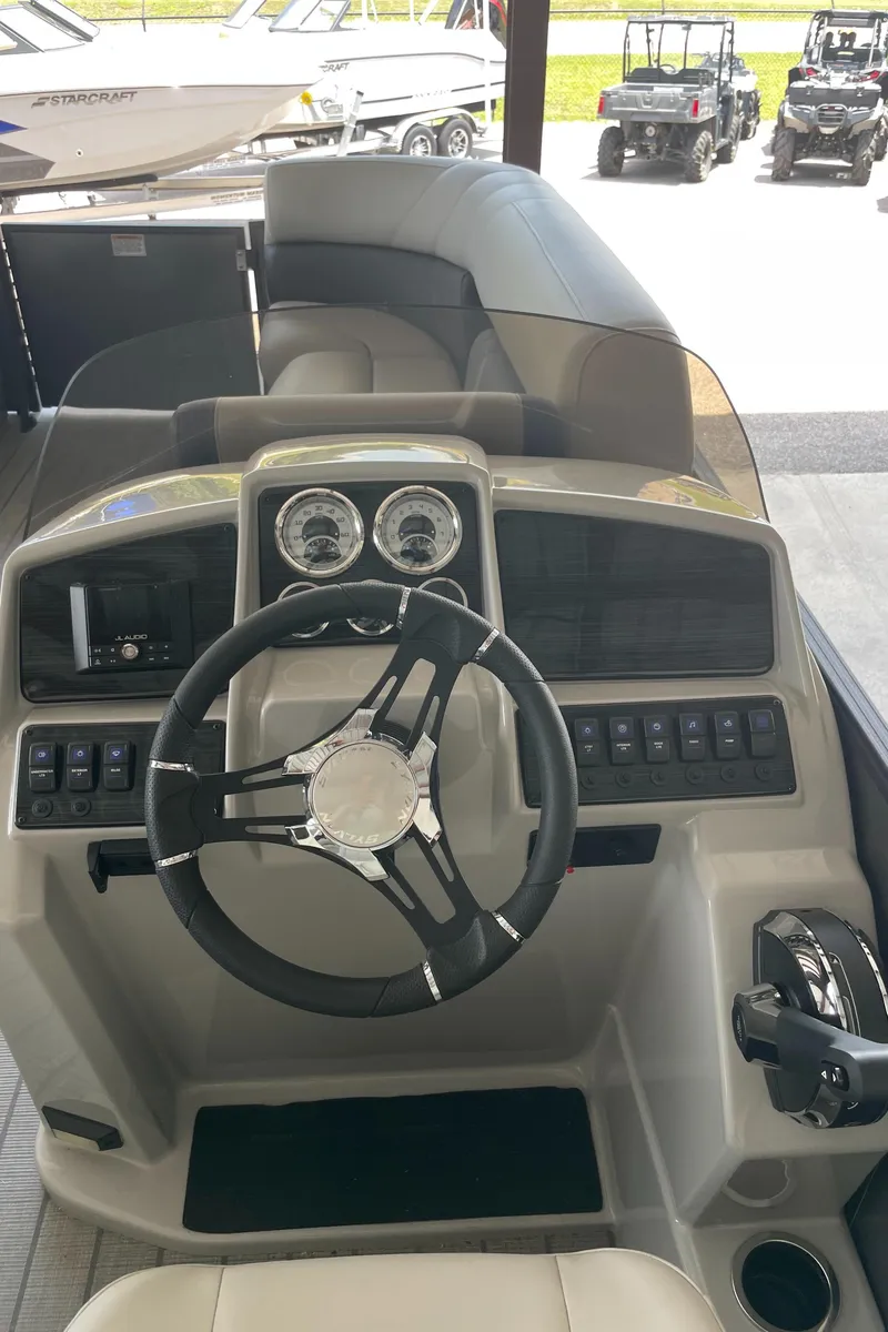 Slide: The Image of 2023 Sylvan Mirage X X5 CLZ boat dashboard and steering wheel. - 13