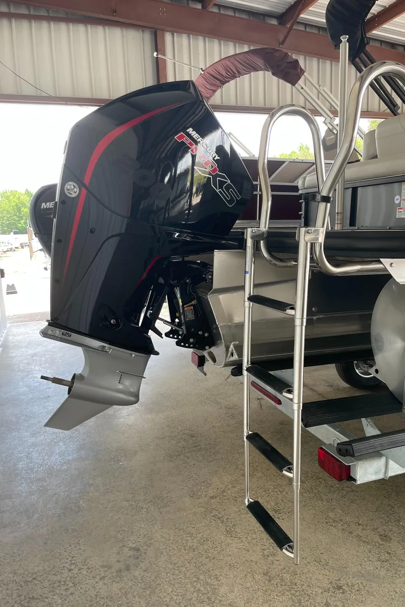 Slide: The Image of 2023 Sylvan Mirage X X5 CLZ boat with outboard motor and ladder. - 15