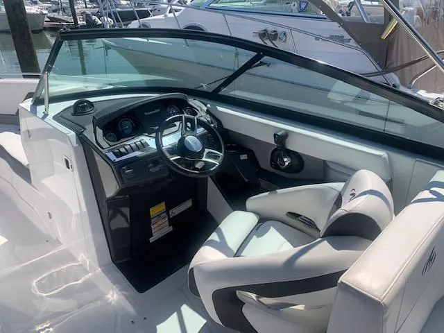 Slide: The Image of 2017 Monterey 258 SS boat interior with steering wheel and dashboard. - 13