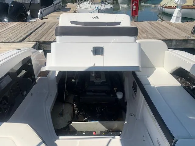 Slide: The Image of 2017 Monterey 258 SS boat with open engine compartment at dock. - 8
