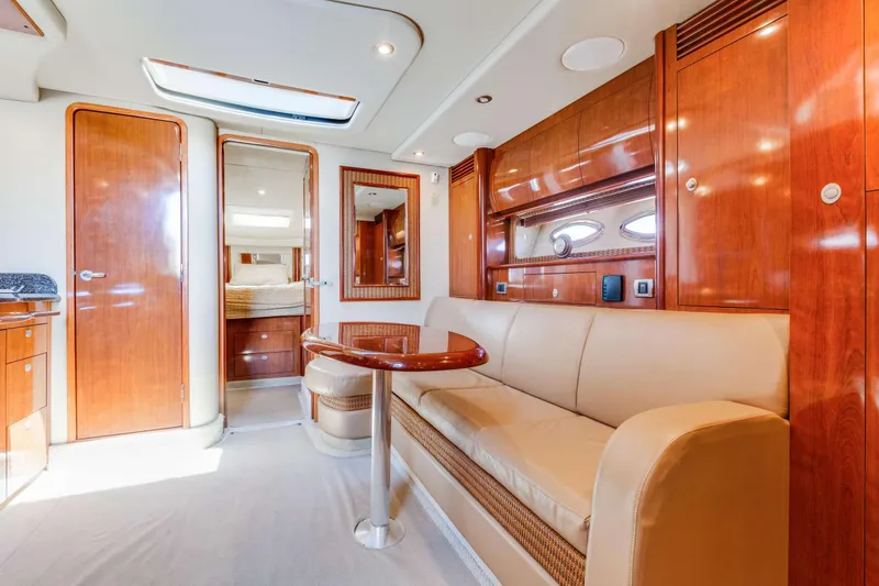 Slide: The Image of Luxurious interior of 2005 Sea Ray 390 Sundancer yacht with elegant wood finishes and comfortable seating. - 1