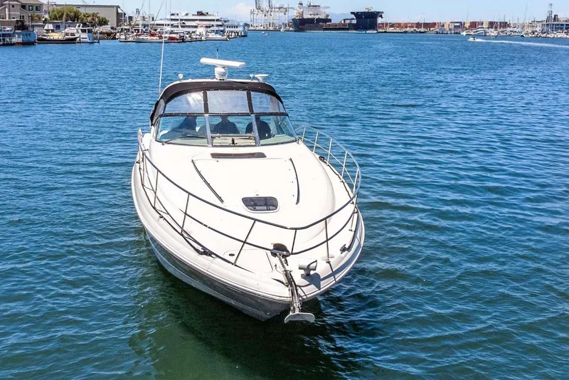 Slide: The Image of 2005 Sea Ray 390 Sundancer yacht cruising in a sunny harbor. - 12