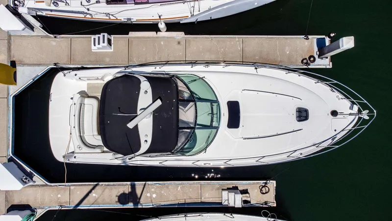 Slide: The Image of Aerial view of a 2005 Sea Ray 390 Sundancer docked at a marina. - 13