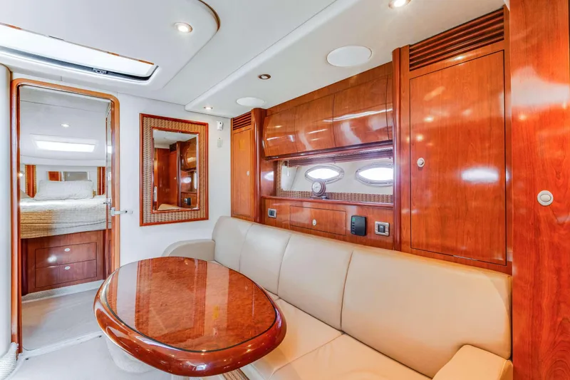 Slide: The Image of Luxurious interior of 2005 Sea Ray 390 Sundancer yacht with elegant wood finishes. - 19