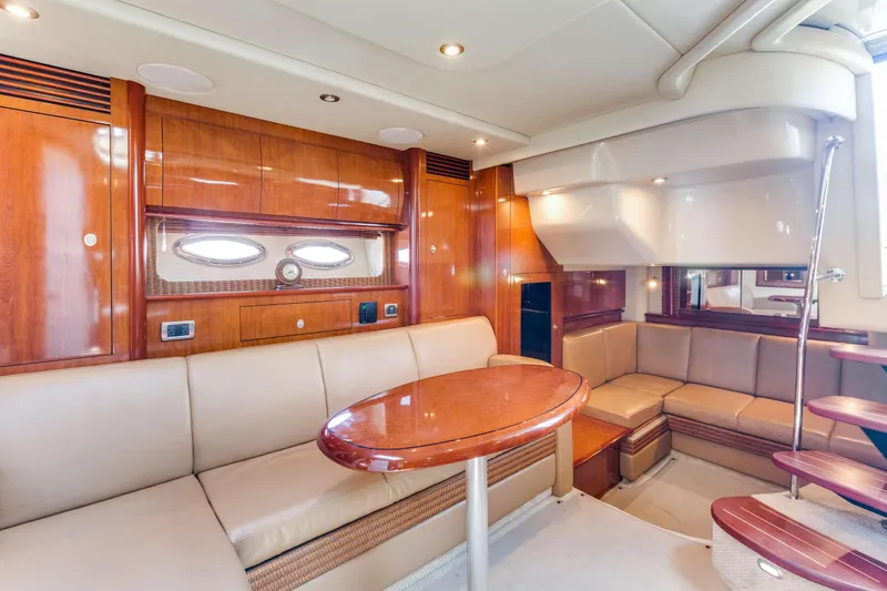 Slide: The Image of Luxurious interior of 2005 Sea Ray 390 Sundancer yacht with elegant seating and wooden finishes. - 20