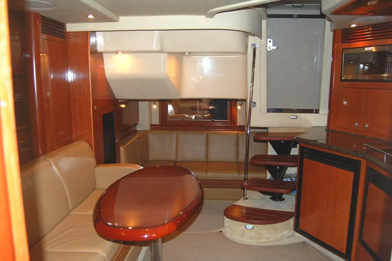 Slide: The Image of Luxurious interior of 2005 Sea Ray 390 Sundancer yacht with elegant wood finishes. - 25