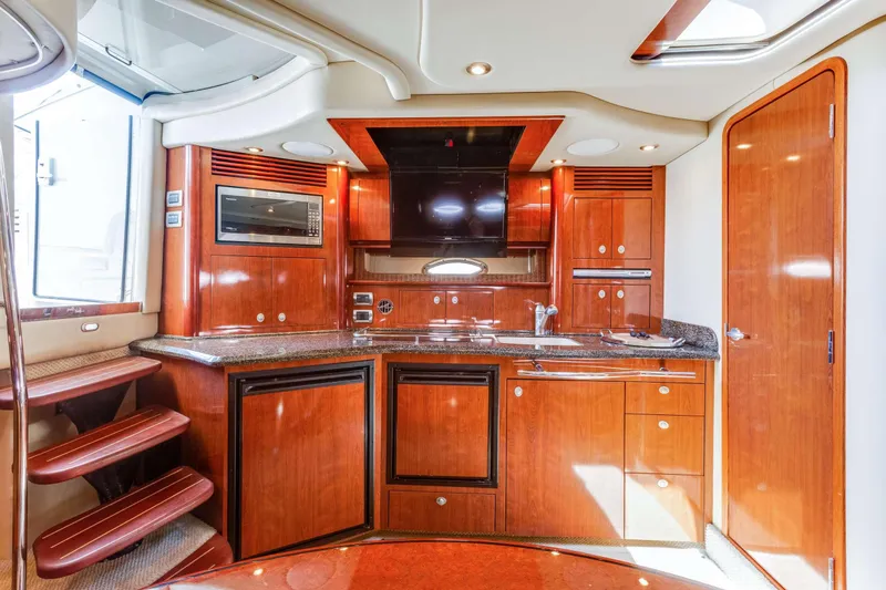Slide: The Image of Luxurious 2005 Sea Ray 390 Sundancer yacht interior with modern kitchen amenities. - 3