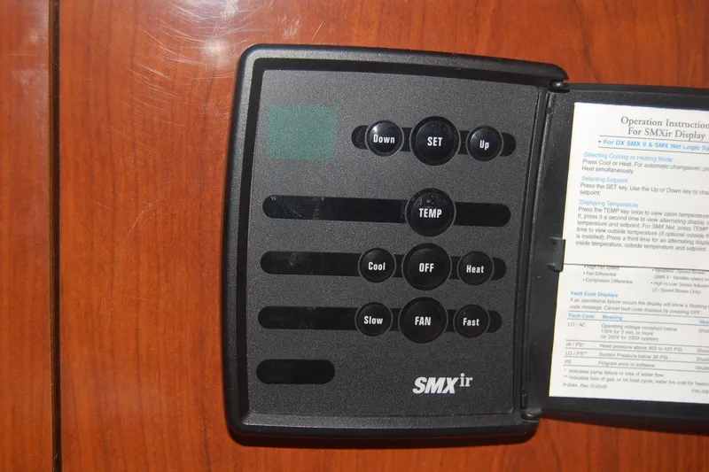 Slide: The Image of SMXir control panel on 2005 Sea Ray 390 Sundancer yacht, featuring temperature and fan settings. - 31