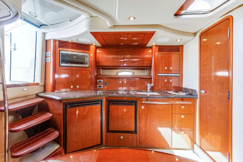 Slide: The Image of Luxurious 2005 Sea Ray 390 Sundancer yacht interior with modern kitchen amenities. - 35