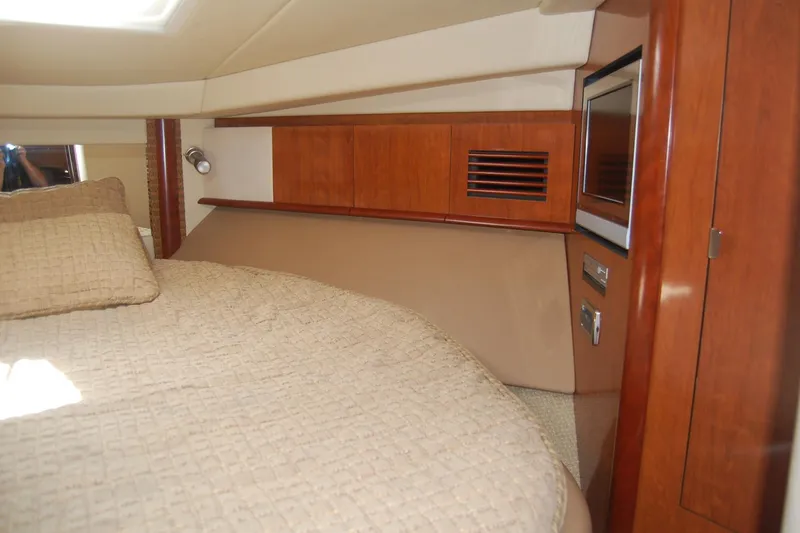 Slide: The Image of Luxurious cabin interior of 2005 Sea Ray 390 Sundancer yacht with cozy bedding. - 43