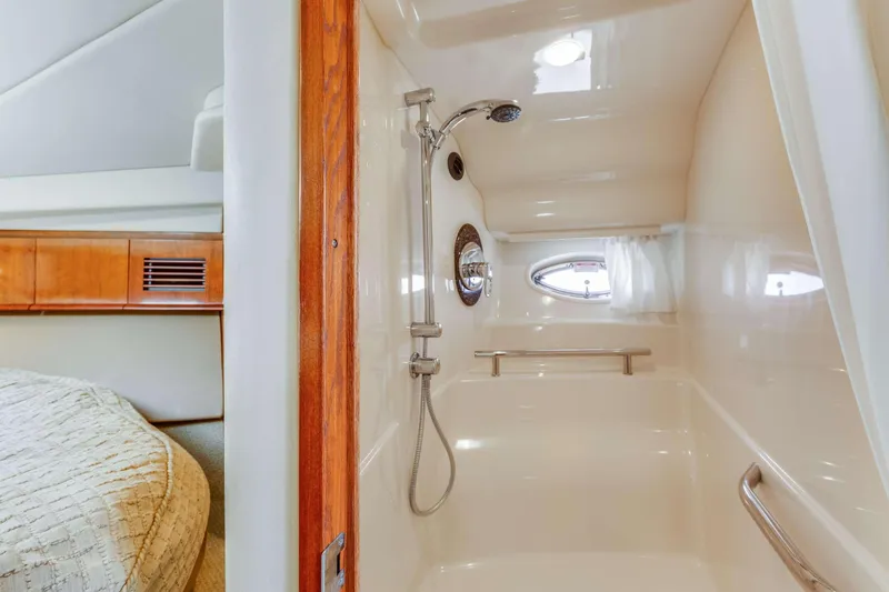 Slide: The Image of Luxurious bathroom in 2005 Sea Ray 390 Sundancer yacht with shower and porthole. - 47