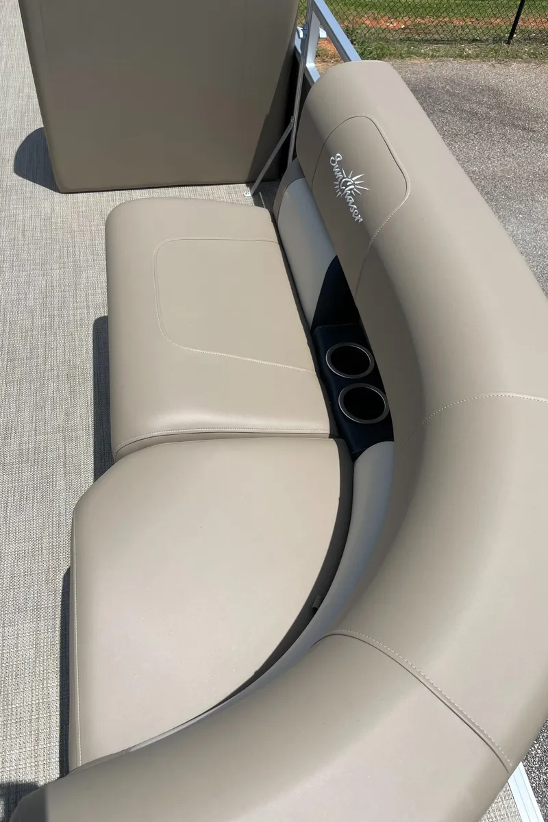Slide: The Image of 2023 SunChaser Vista 18 LR boat with beige seating and cup holders. - 3
