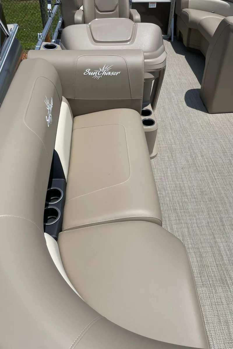 Slide: The Image of 2023 SunChaser Vista 18 LR pontoon boat with beige seating and cup holders. - 4