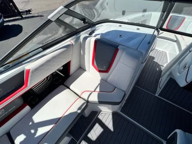 Slide: The Image of 2016 Nautique G21 boat interior with white and red seating. - 13