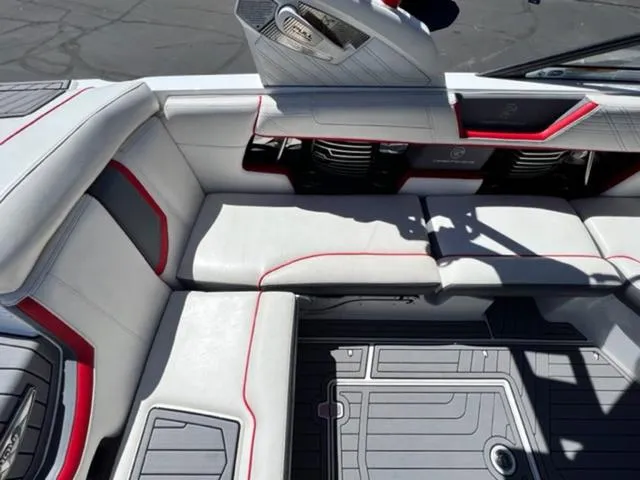 Slide: The Image of 2016 Nautique G21 boat interior with white and red seating. - 14