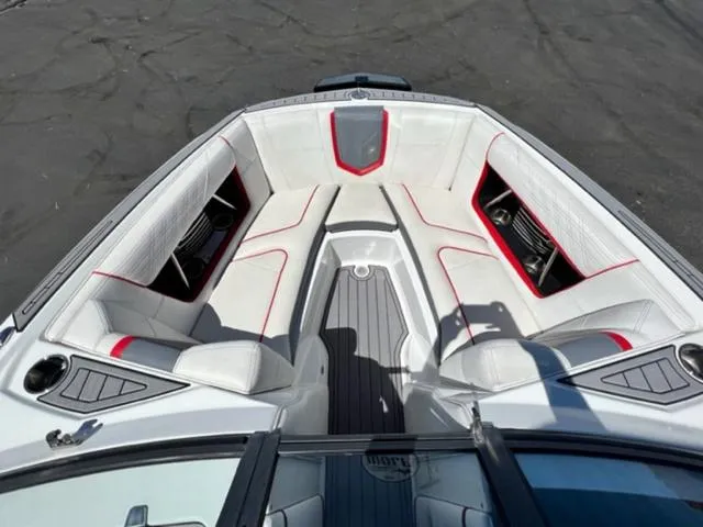 Slide: The Image of 2016 Nautique G21 boat interior with white and red seating. - 17