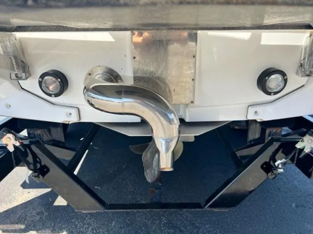 Slide: The Image of 2016 Nautique G21 boat stern with exhaust and propeller. - 9