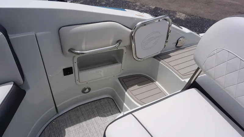 Slide: The Image of 2024 Crownline 290 XSS boat interior with seating and storage compartments. - 19