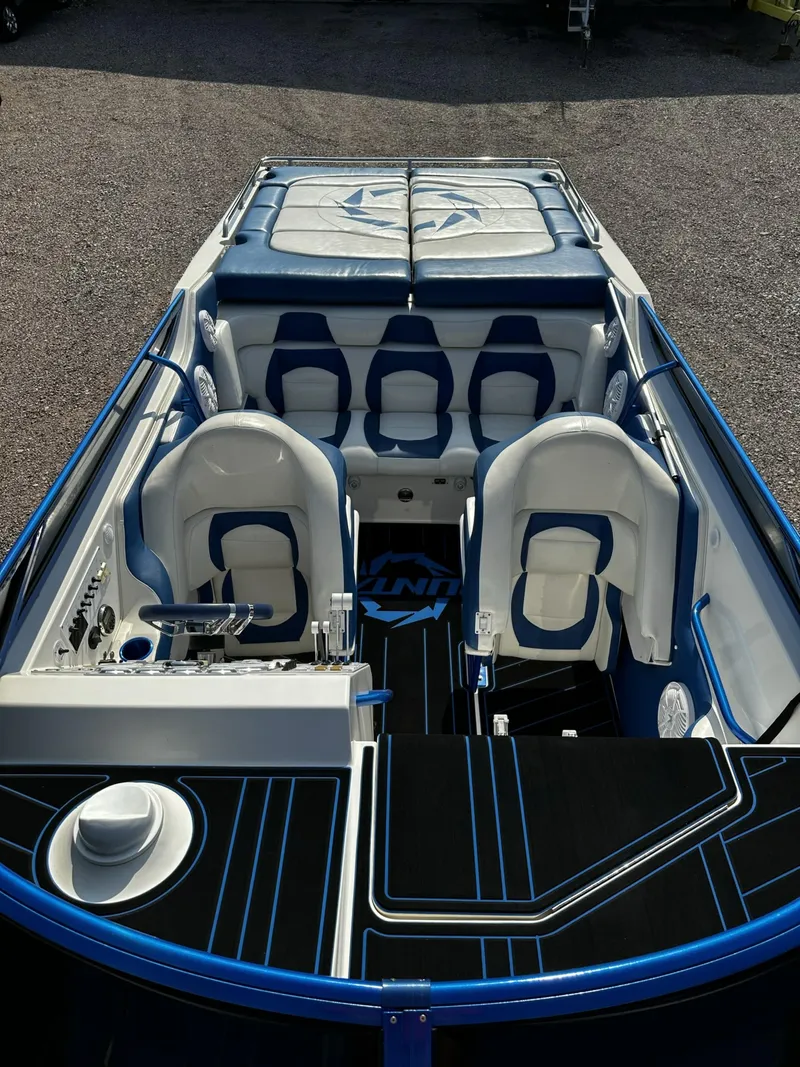 Slide: The Image of 2002 Fountain 42 Lightning speedboat with blue and white interior. - 12