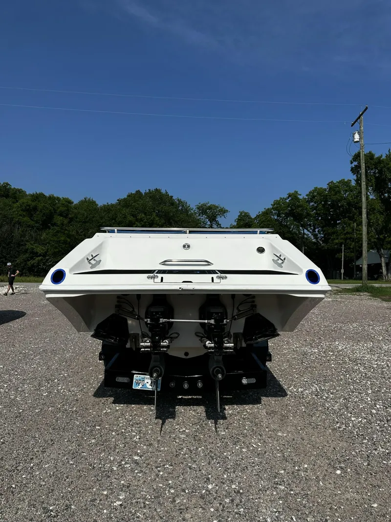 Slide: The Image of Rear view of a 2002 Fountain 42 Lightning boat on gravel lot. - 3