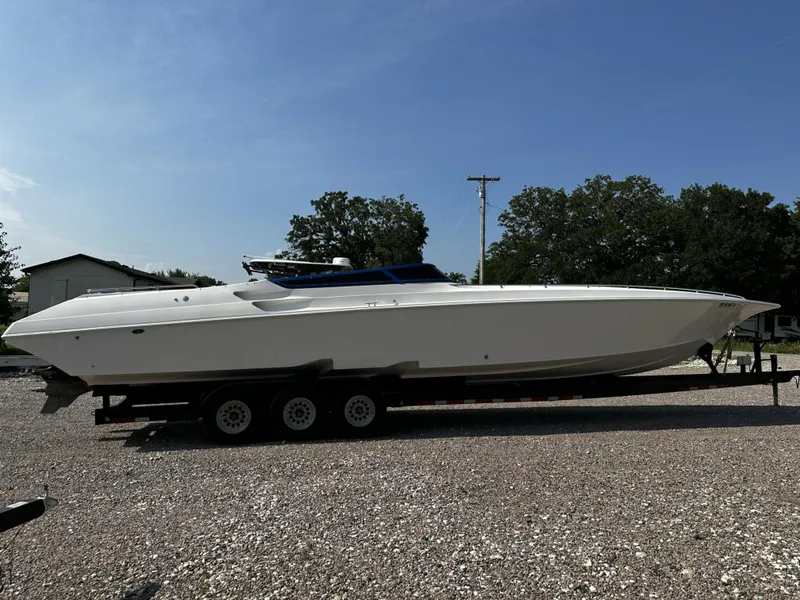 Slide: The Image of 2002 Fountain 42 Lightning speedboat on a trailer in a gravel lot. - 5
