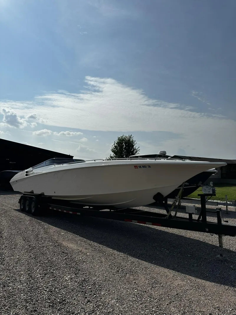 Slide: The Image of 2002 Fountain 42 Lightning speedboat on a trailer under a clear sky. - 6