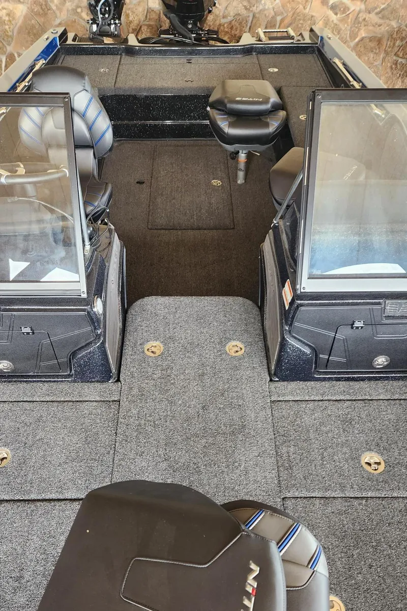Slide: The Image of 2023 Nitro ZV20 Pro fishing boat interior with seating and storage compartments. - 5