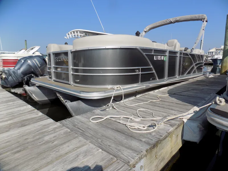Slide: The Image of 2021 Sylvan Mirage 8522 LZ pontoon boat docked at marina. - 0