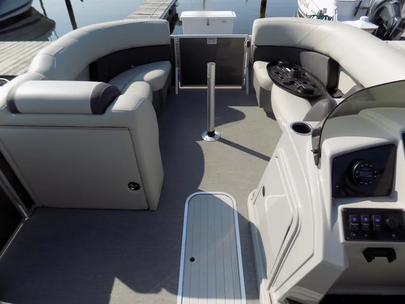 Slide: The Image of 2021 Sylvan Mirage 8522 LZ pontoon boat interior with plush seating and modern dashboard. - 8