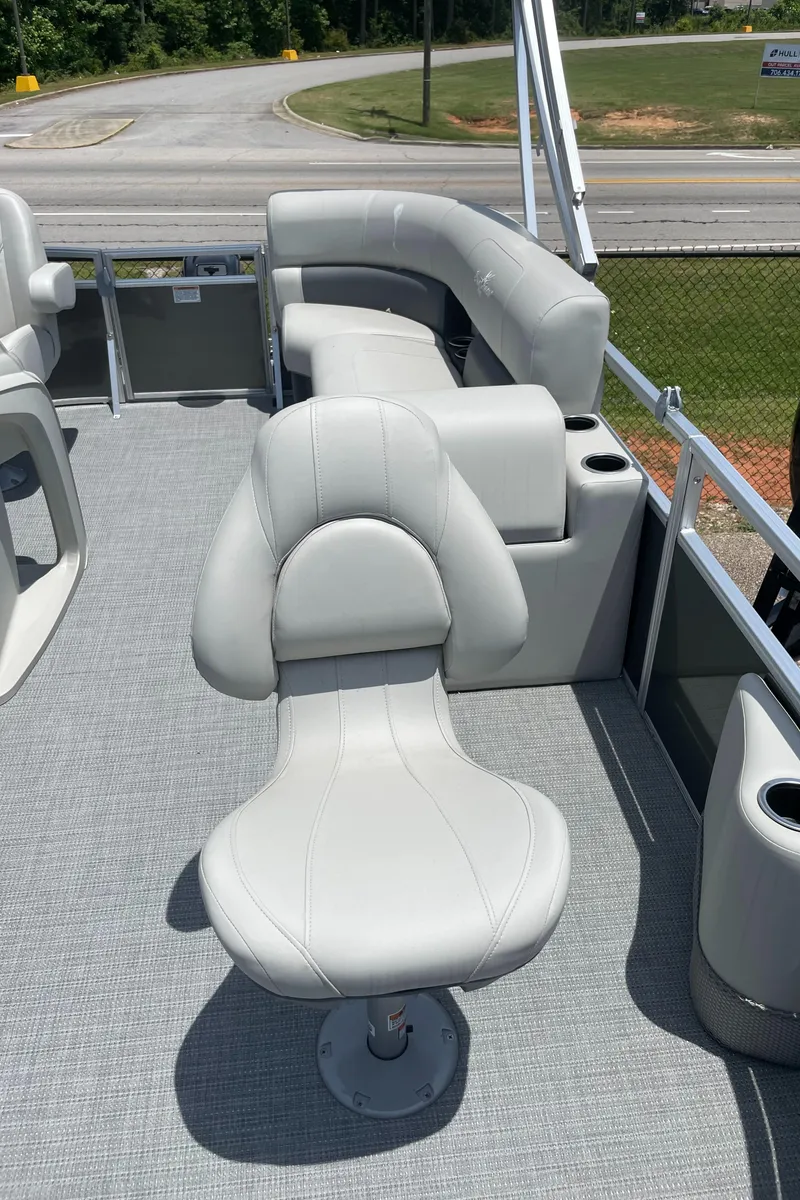 Slide: The Image of 2023 SunChaser Vista 16 Fish boat interior with seating and cup holders. - 3
