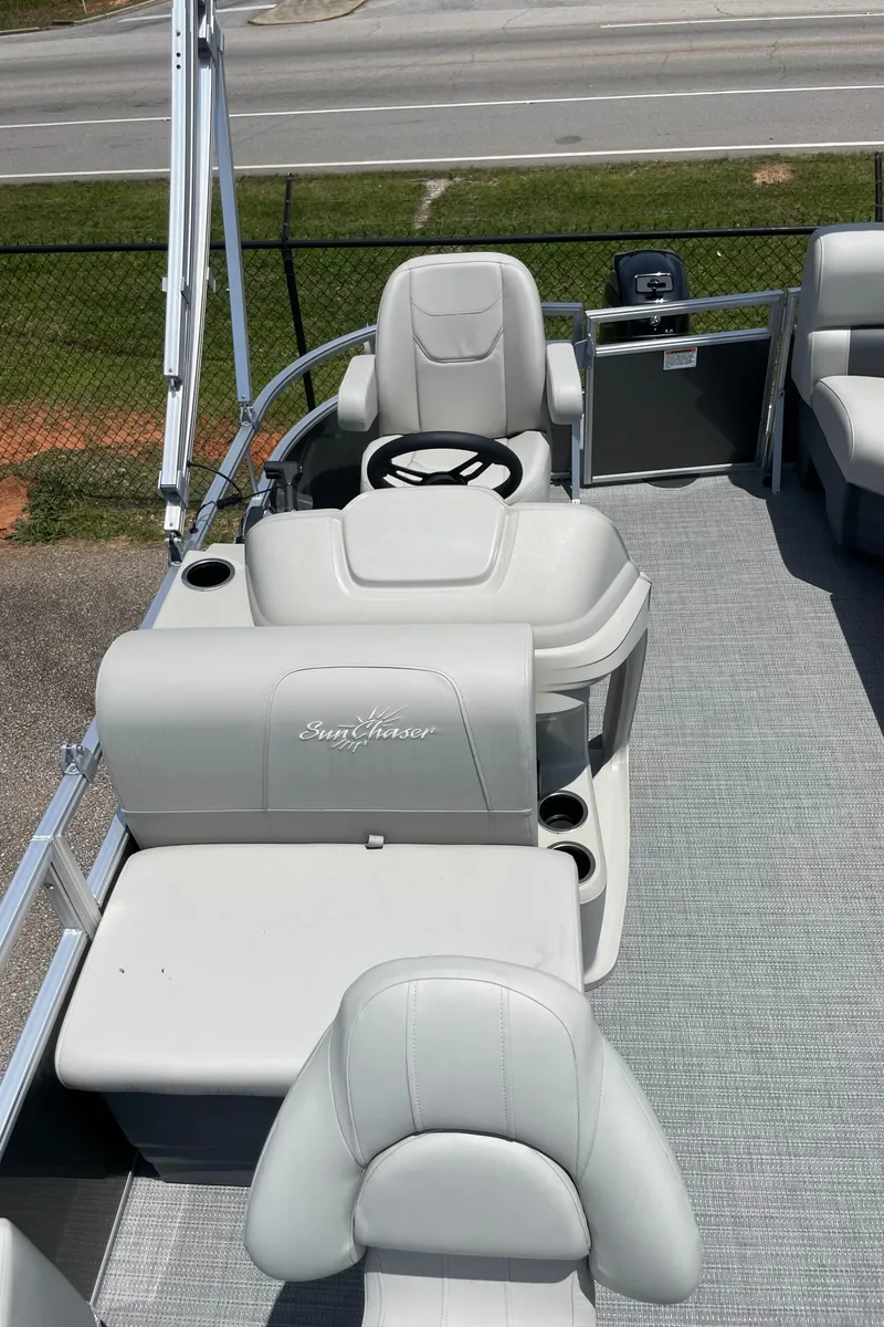 Slide: The Image of 2023 SunChaser Vista 16 Fish pontoon boat interior with seating and steering console. - 4
