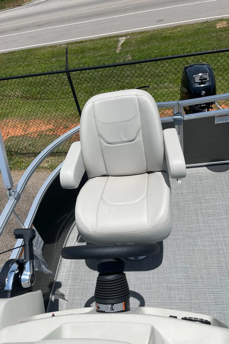 Slide: The Image of 2023 SunChaser Vista 16 Fish boat captain's chair and control console. - 6