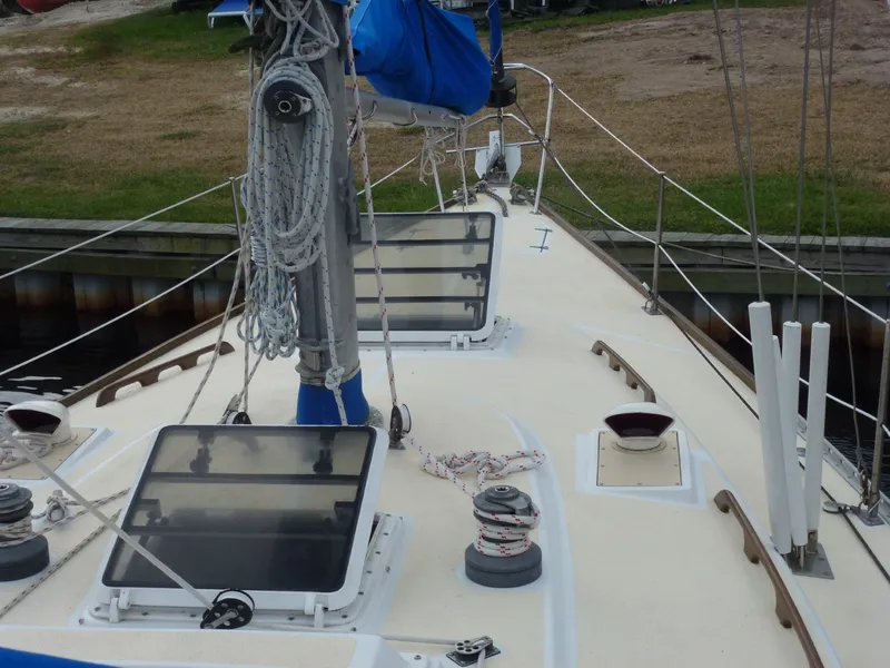 Slide: The Image of 1984 Morgan 454 sailboat deck with rigging and hatches. - 17