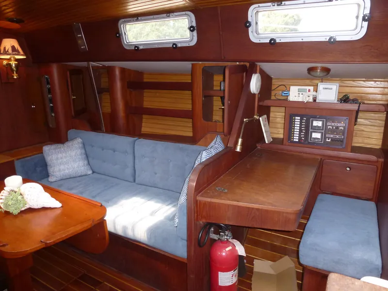 Slide: The Image of Interior of a 1984 Morgan 454 yacht with blue upholstery. - 26
