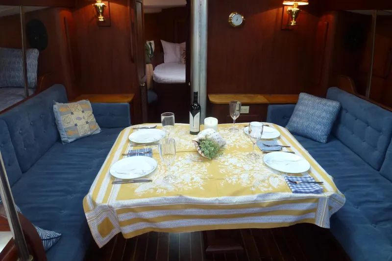 Slide: The Image of Interior of a 1984 Morgan 454 yacht with a set dining table. - 27