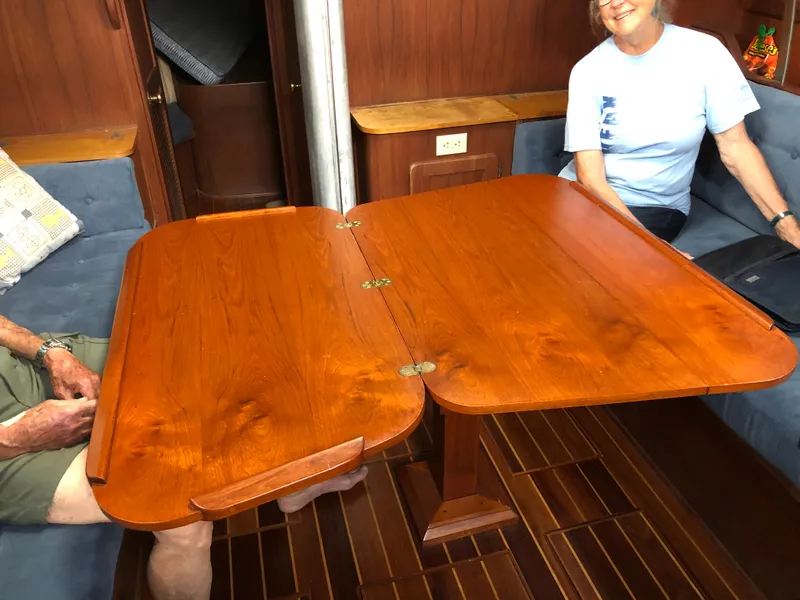 Slide: The Image of Interior of a 1984 Morgan 454 with wooden table and blue upholstery. - 28