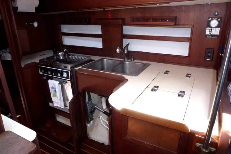 Slide: The Image of 1984 Morgan 454 yacht interior kitchen with sink and stove. - 29