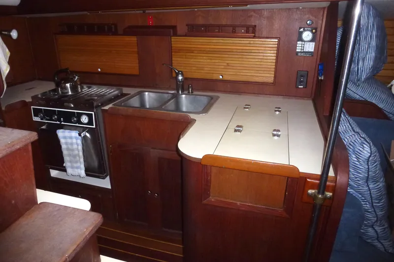 Slide: The Image of 1984 Morgan 454 yacht interior kitchen with wooden cabinetry. - 30