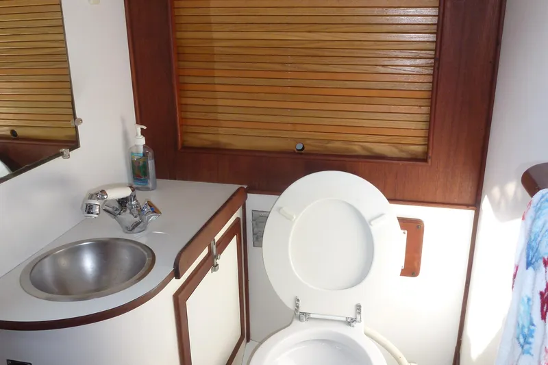 Slide: The Image of 1984 Morgan 454 interior with sink and toilet. - 34