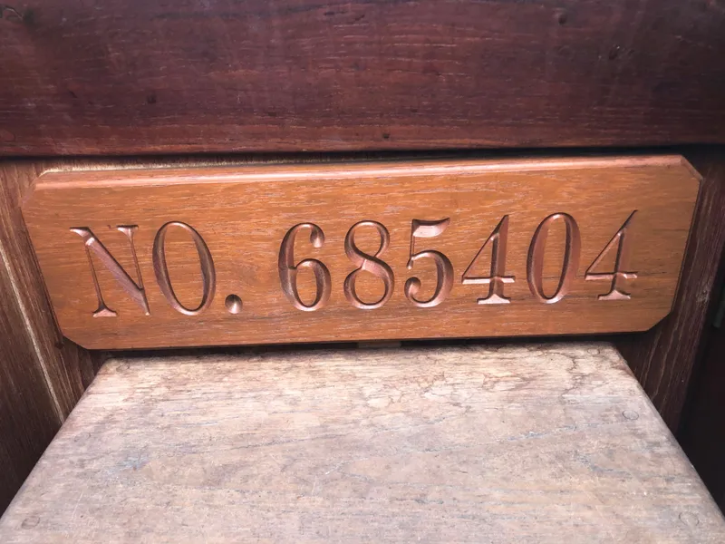 Slide: The Image of Wooden plaque with engraved number 685404, Morgan 454, year 1984. - 36