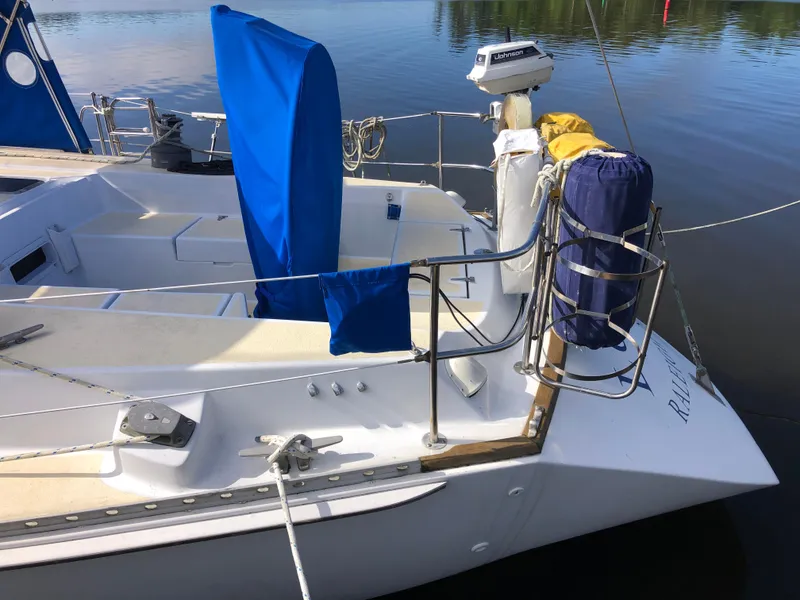 Slide: The Image of 1984 Morgan 454 sailboat docked on calm water. - 4