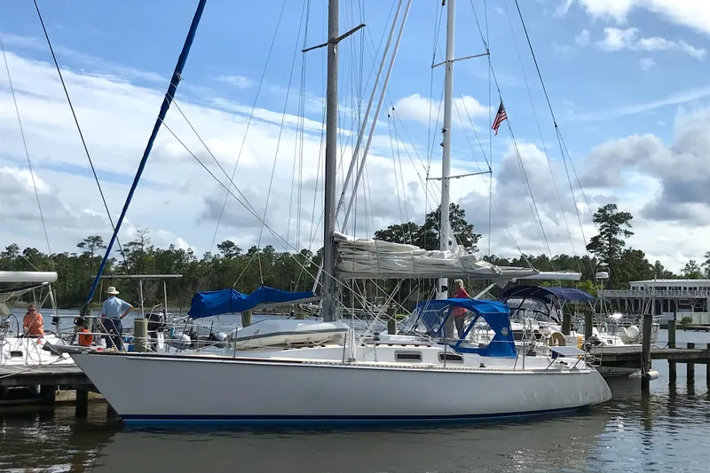 Slide: The Image of 1984 Morgan 454 sailboat docked at marina, blue sky. - 9