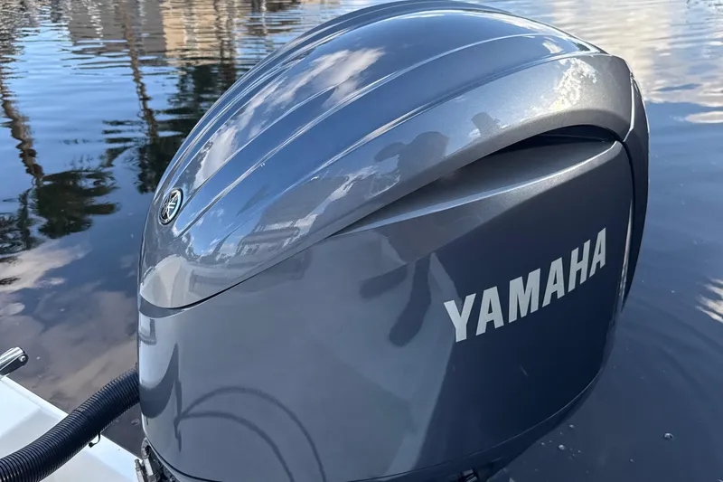 Slide: The Image of Yamaha outboard motor on a 2020 Cobia 220 boat, reflecting water and sky. - 11
