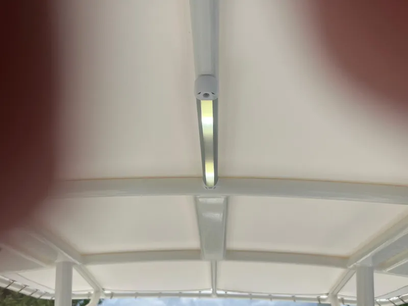 Slide: The Image of LED light on 2020 Cobia 220 boat's canopy ceiling. - 13