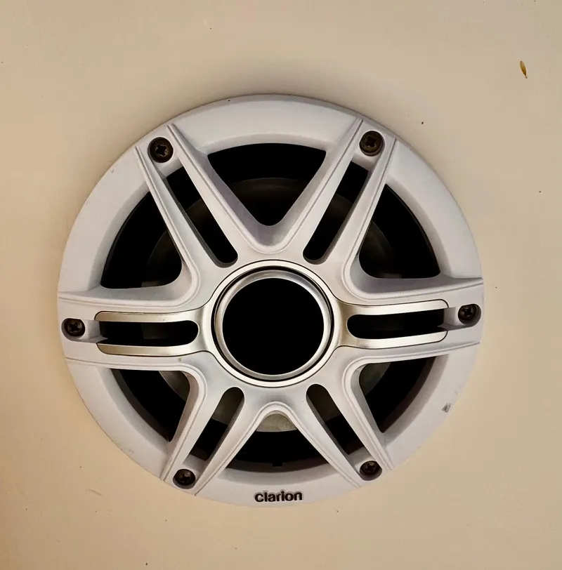 Slide: The Image of Clarion speaker on 2020 Cobia 220 boat, featuring a sleek white grille design. - 30