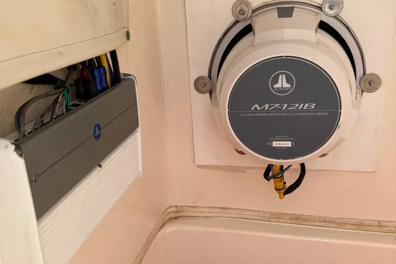 Slide: The Image of Cobia 220 boat interior showing JL Audio M7-12IB subwoofer and wiring, 2020 model. - 33