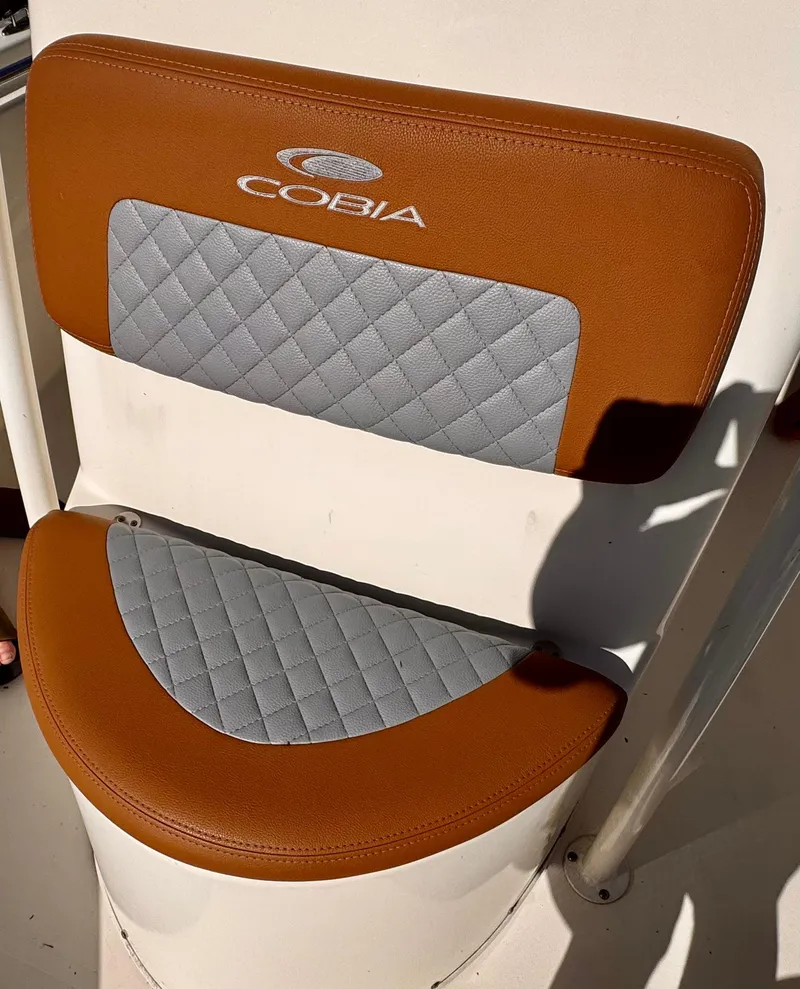 Slide: The Image of Cobia 220 boat seat, 2020 model, featuring brown and gray quilted upholstery. - 4