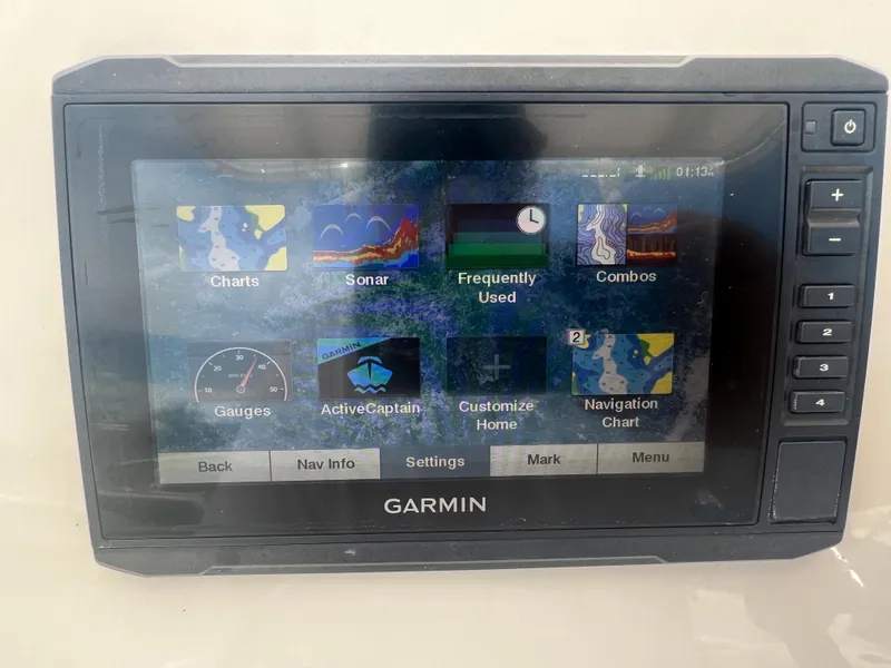 Slide: The Image of Garmin marine GPS display on a 2020 Cobia 220 boat, showing navigation and sonar options. - 7