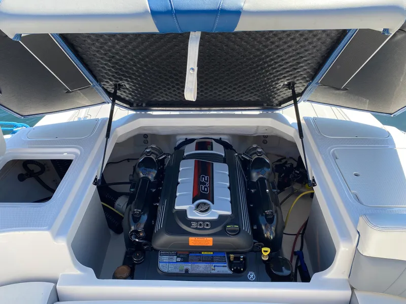 Slide: The Image of 2022 Chaparral 23 SSi boat engine compartment with open hatch. - 20