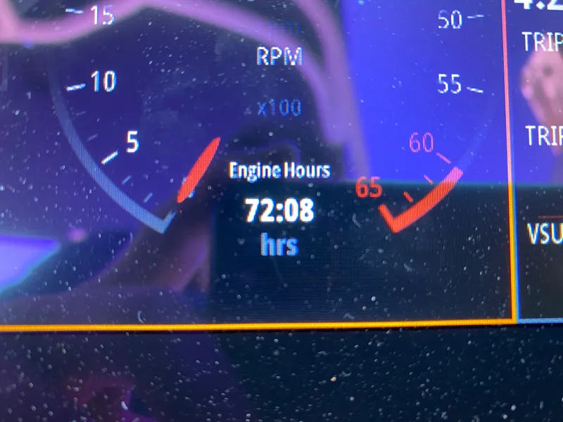 Slide: The Image of Close-up of 2022 Chaparral 23 SSi boat dashboard showing 72.08 engine hours. - 21